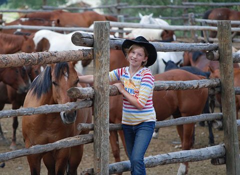 Family posing with a horse