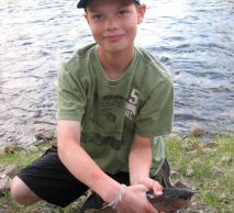 Boy showing off his catch