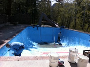Our own "Blue Man Group" prepping the pool.