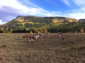 Fall colors provide a glorious backdrop as we head out for an evening ride here on our southern Colorado dude ranch.