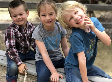 Smiling kids with their guide