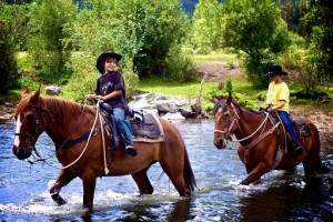 Cowpokes crossing the river - photo by Lance Harrison